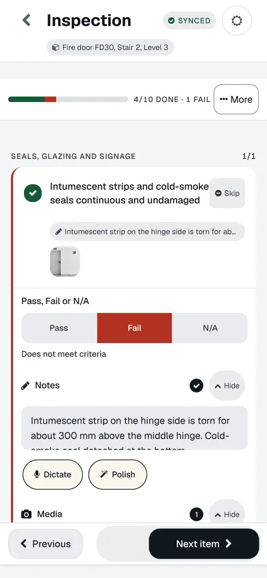 A fire door check on a phone: synced, 4 of 10 done, the seals item failed with a note and a photo, Pass Fail N/A controls, Dictate and Polish.